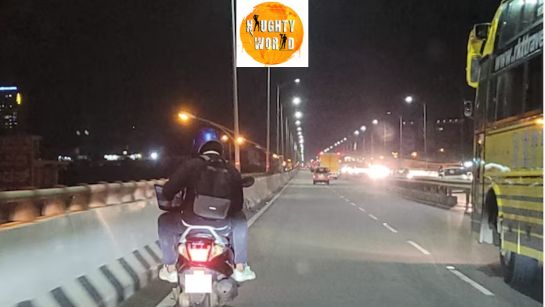 Trending: A man is seen working on a laptop at 12.15 am while on his bike